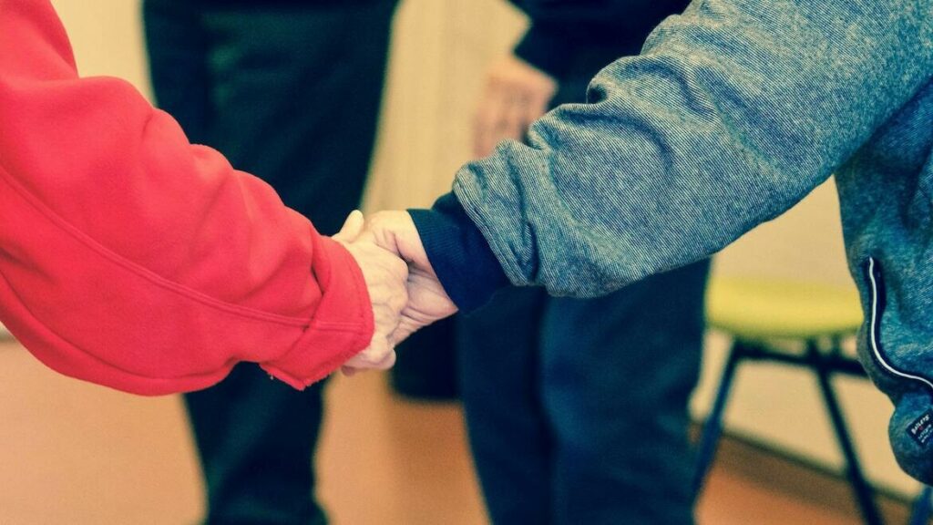 2-persons-holding-their-hands-233223 (1) 2-persons-holding-their-hands-233223 (1)