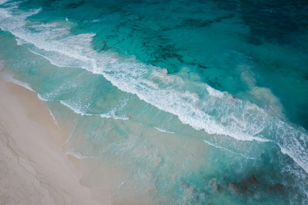 a wave crashing on a beach