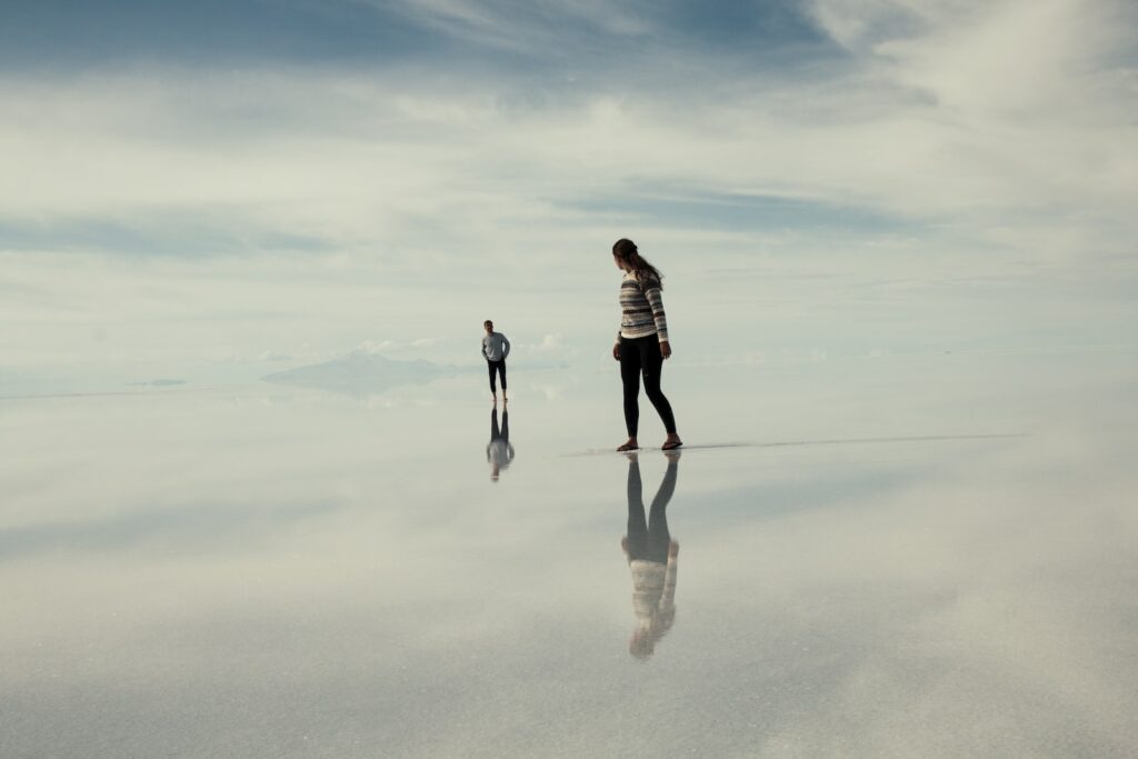 man and woman walking on clouds