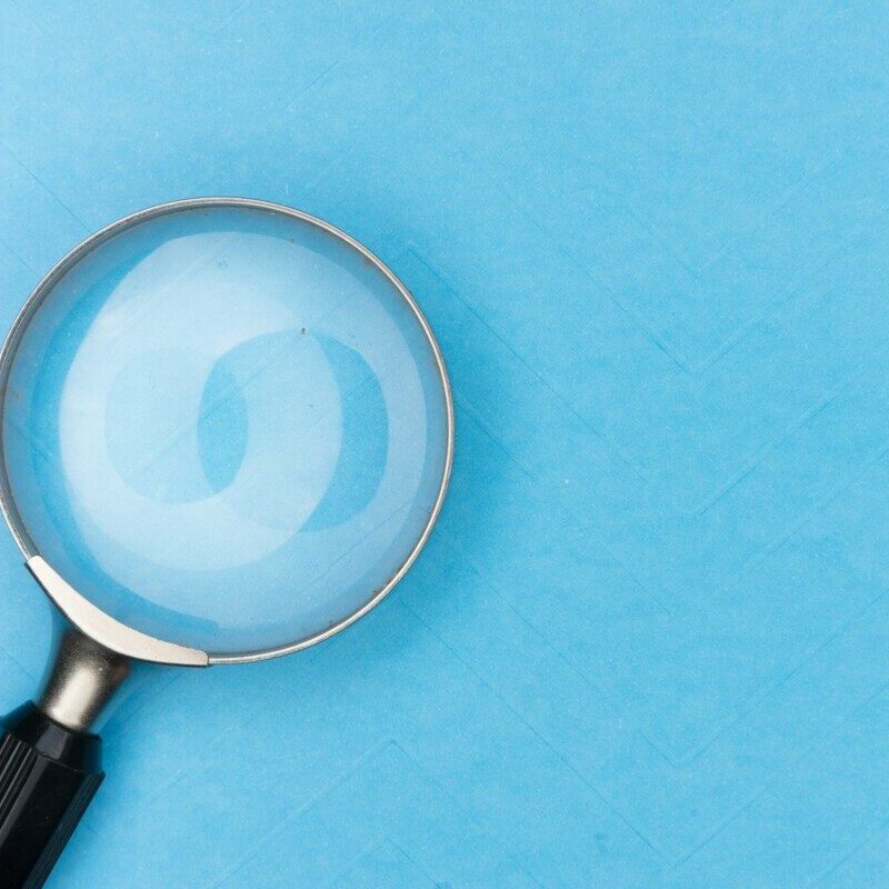 magnifying glass on white table