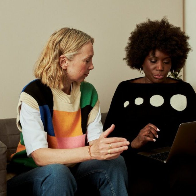 Photo by Centre for Ageing Better two women sitting on a couch looking at a laptop