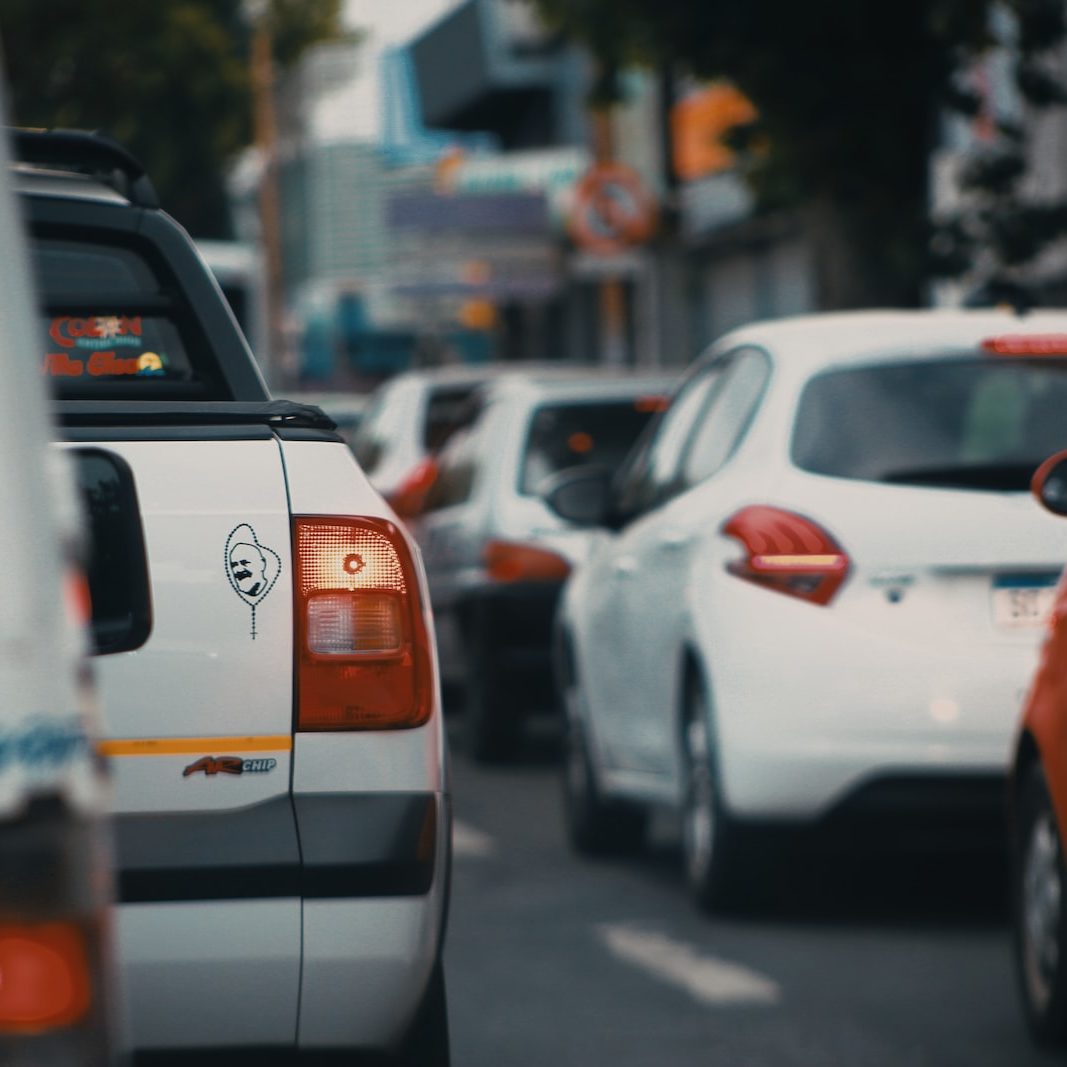 white and orange car on road during daytime