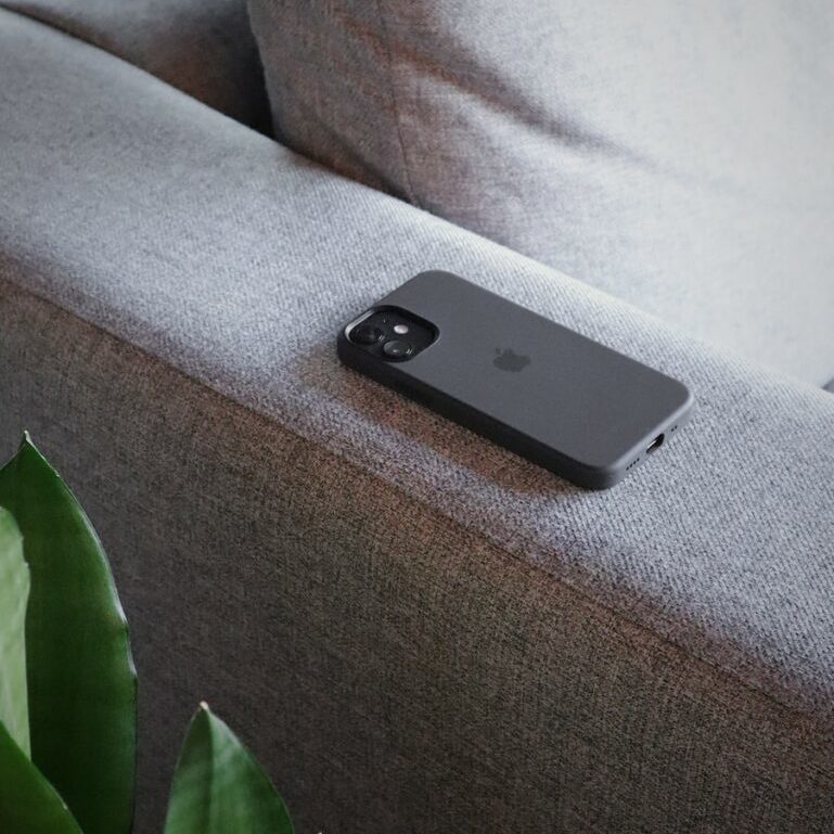 black iphone 5 on gray sofa