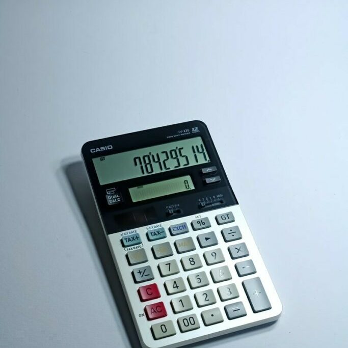 Photo par Manik Roy white and black canon calculator